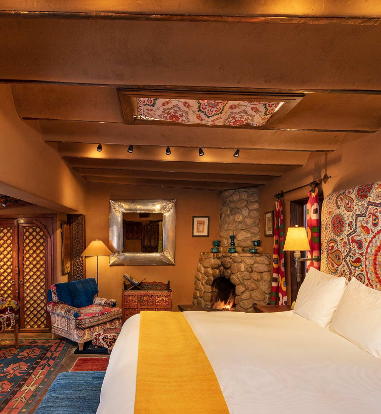 The bedroom in Aria, one of our guest rooms at The Inn of The Five Graces, a Luxury Boutique Hotel and resort in Downtown Santa Fe, New Mexico.