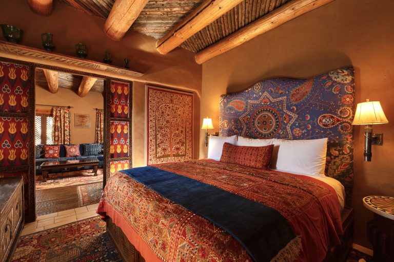 The bedroom in Adobe Rose; the newest suite at The Inn of The Five Graces, a Luxury Boutique Hotel and Resort in Downtown Santa Fe, New Mexico.