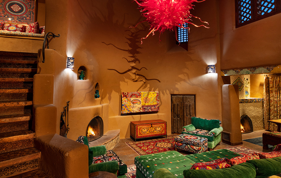 The Luminaria Villa living room with a custom blown glass chandelier at The Inn of The Five Graces, a Luxury Boutique Hotel and Resort in downtown Santa Fe, New Mexico.